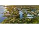 Bird's eye view of waterfront home with private dock and spacious yard at 159 Danforth Dr, Punta Gorda, FL 33980