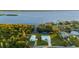 Aerial view of waterfront home with private dock and lush landscaping at 159 Danforth Dr, Punta Gorda, FL 33980