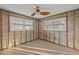Large bedroom under renovation with new windows and ceiling fan at 159 Danforth Dr, Punta Gorda, FL 33980