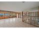 Large living room undergoing renovation with tiled floors and new windows at 159 Danforth Dr, Punta Gorda, FL 33980