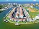 Aerial view showing waterfront community, boat slips, and nearby recreational areas at 169 Medallion Blvd # E, Madeira Beach, FL 33708