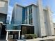 Two-story condo building with light blue and white exterior and balcony at 169 Medallion Blvd # E, Madeira Beach, FL 33708