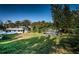 Backyard with a small house and boat at 1820 Sutherland W Dr, Palm Harbor, FL 34683