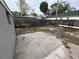 Fenced backyard with a large concrete patio at 1829 31St N Ave, St Petersburg, FL 33713