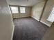 Spacious bedroom with carpet and multiple windows at 1829 31St N Ave, St Petersburg, FL 33713