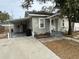 Front view of house with carport and small yard at 1829 31St N Ave, St Petersburg, FL 33713