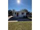 Newly renovated home with red door, front porch and driveway at 1904 W Saint Louis St, Tampa, FL 33607