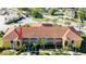 Aerial view highlighting the building's design and landscaping at 21012 Picasso Ct # J205, Land O Lakes, FL 34637