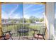 Spacious screened balcony overlooking a tranquil landscape at 21012 Picasso Ct # J205, Land O Lakes, FL 34637