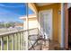 Screened balcony with table and chairs, offering a relaxing outdoor space at 21012 Picasso Ct # J205, Land O Lakes, FL 34637