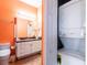 Clean bathroom with updated vanity and stackable washer/dryer at 21012 Picasso Ct # J205, Land O Lakes, FL 34637