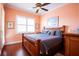 Spacious bedroom with a king-size bed and large windows at 21012 Picasso Ct # J205, Land O Lakes, FL 34637