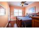 Bright bedroom featuring a king-size bed and a private balcony at 21012 Picasso Ct # J205, Land O Lakes, FL 34637