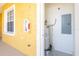 Exterior utility closet with water heater and electrical panel at 21012 Picasso Ct # J205, Land O Lakes, FL 34637