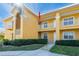 Building exterior showcasing a well-maintained building with attractive landscaping at 21012 Picasso Ct # J205, Land O Lakes, FL 34637