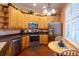 Well-equipped kitchen with stainless steel appliances and wood cabinets at 21012 Picasso Ct # J205, Land O Lakes, FL 34637