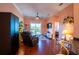 Spacious living room with hardwood floors and access to a balcony at 21012 Picasso Ct # J205, Land O Lakes, FL 34637