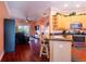 Open floor plan with kitchen, living room, and balcony access at 21012 Picasso Ct # J205, Land O Lakes, FL 34637