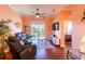 Relaxing living room featuring leather furniture and hardwood floors at 21012 Picasso Ct # J205, Land O Lakes, FL 34637