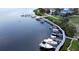 Aerial view of waterfront property with boat slips at 25 Harborpointe Dr, Port Richey, FL 34668