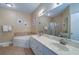 Elegant bathroom with double vanity, soaking tub, and separate shower at 2749 Via Cipriani # 1010B, Clearwater, FL 33764