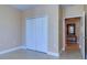 Spacious bedroom with double door closet and access to hallway at 2749 Via Cipriani # 1010B, Clearwater, FL 33764