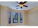 Bright bedroom with bay window and ceiling fan at 2749 Via Cipriani # 1010B, Clearwater, FL 33764