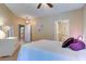 Comfortable bedroom with ceiling fan and access to bathroom at 2749 Via Cipriani # 1010B, Clearwater, FL 33764