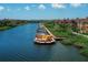 Community boat docks with walkway and lush landscaping at 2749 Via Cipriani # 1010B, Clearwater, FL 33764