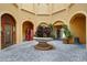 Charming courtyard with brick pavement and fountain at 2749 Via Cipriani # 1010B, Clearwater, FL 33764