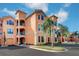 Attractive condo building with palm trees and ample parking at 2749 Via Cipriani # 1010B, Clearwater, FL 33764