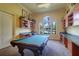 Relaxing game room with a pool table and workspaces at 2749 Via Cipriani # 1010B, Clearwater, FL 33764