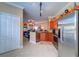 Open kitchen with stainless steel appliances and breakfast bar at 2749 Via Cipriani # 1010B, Clearwater, FL 33764