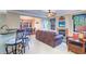Spacious living room with fireplace and leather sofas at 2749 Via Cipriani # 1010B, Clearwater, FL 33764