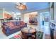 Open concept living area with leather sofas and a coffee table at 2749 Via Cipriani # 1010B, Clearwater, FL 33764