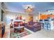 Open living room with a view of the kitchen and dining area at 2749 Via Cipriani # 1010B, Clearwater, FL 33764