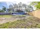 Large backyard with a new home and wooden fence at 2859 38Th N Ave, St Petersburg, FL 33713