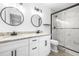 Modern bathroom with double vanity, granite countertop, and walk-in shower at 2859 38Th N Ave, St Petersburg, FL 33713