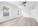 Bedroom with ceiling fan, vinyl plank flooring, and access to bathroom at 2859 38Th N Ave, St Petersburg, FL 33713