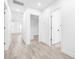 Bright hallway with light gray vinyl plank flooring and white doors at 2859 38Th N Ave, St Petersburg, FL 33713