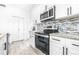 Modern kitchen with stainless steel appliances and granite countertops at 2859 38Th N Ave, St Petersburg, FL 33713
