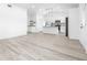 Modern kitchen with white cabinets, an island, and wood-look floors at 2859 38Th N Ave, St Petersburg, FL 33713