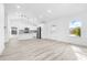 Open concept kitchen with white cabinets and an island at 2859 38Th N Ave, St Petersburg, FL 33713