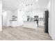 Modern kitchen with white cabinets, island, and granite countertops at 2859 38Th N Ave, St Petersburg, FL 33713