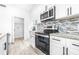 Laundry room with shelving and hookups for washer and dryer at 2859 38Th N Ave, St Petersburg, FL 33713