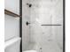 Walk-in shower with marble-style tile and glass enclosure at 2859 38Th N Ave, St Petersburg, FL 33713