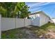 Side yard with white fence and gate access at 3312 W Swann Ave, Tampa, FL 33609