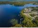 Aerial view of lakefront community and homes at 3541 Oak Lake Dr, Palm Harbor, FL 34684