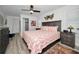 Spacious main bedroom with king-size bed and ensuite bathroom at 3541 Oak Lake Dr, Palm Harbor, FL 34684