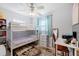 Bedroom with bunk bed, desk and window curtains at 3724 15Th Se Ave, Largo, FL 33771